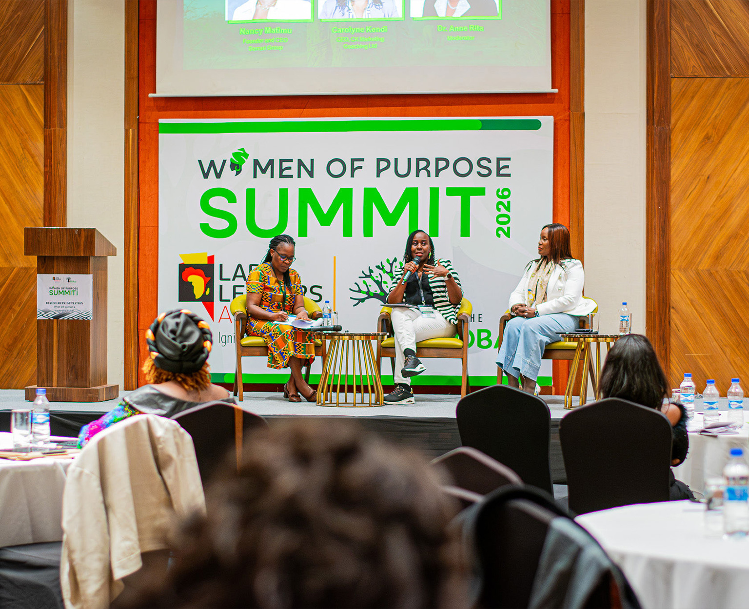 Women gathered at tables at the Women of Purpose Summit
